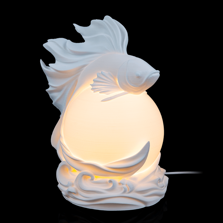 Side view of Betta Fish Sphere Desk Lamp showing elegant fin-like details around spherical light