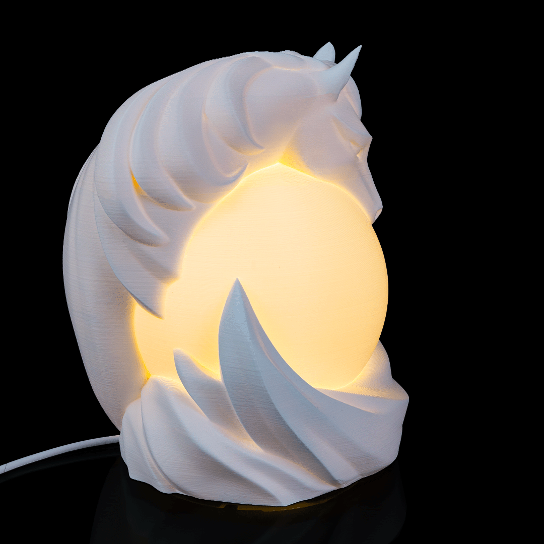 Stallion Sphere Desk Lamp placed on desk creating warm ambient lighting in workspace