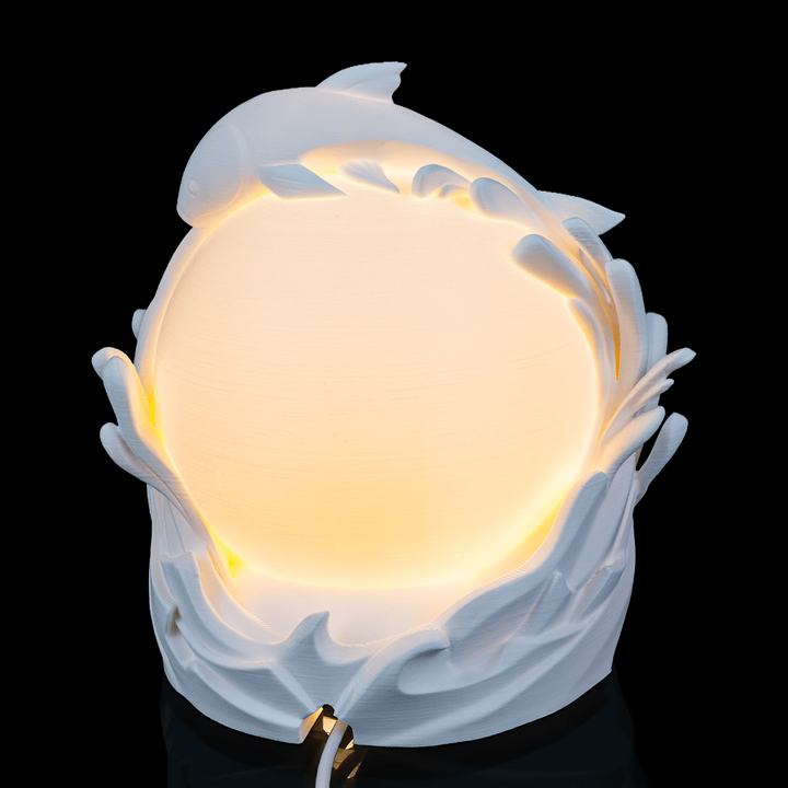 Close-up of Twin Fish Sphere Lamp highlighting layered fish details and globe texture