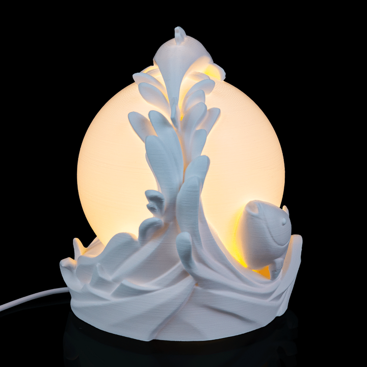 Twin Fish Sphere Lamp placed on a nightstand creating soft ambient lighting in a cozy room