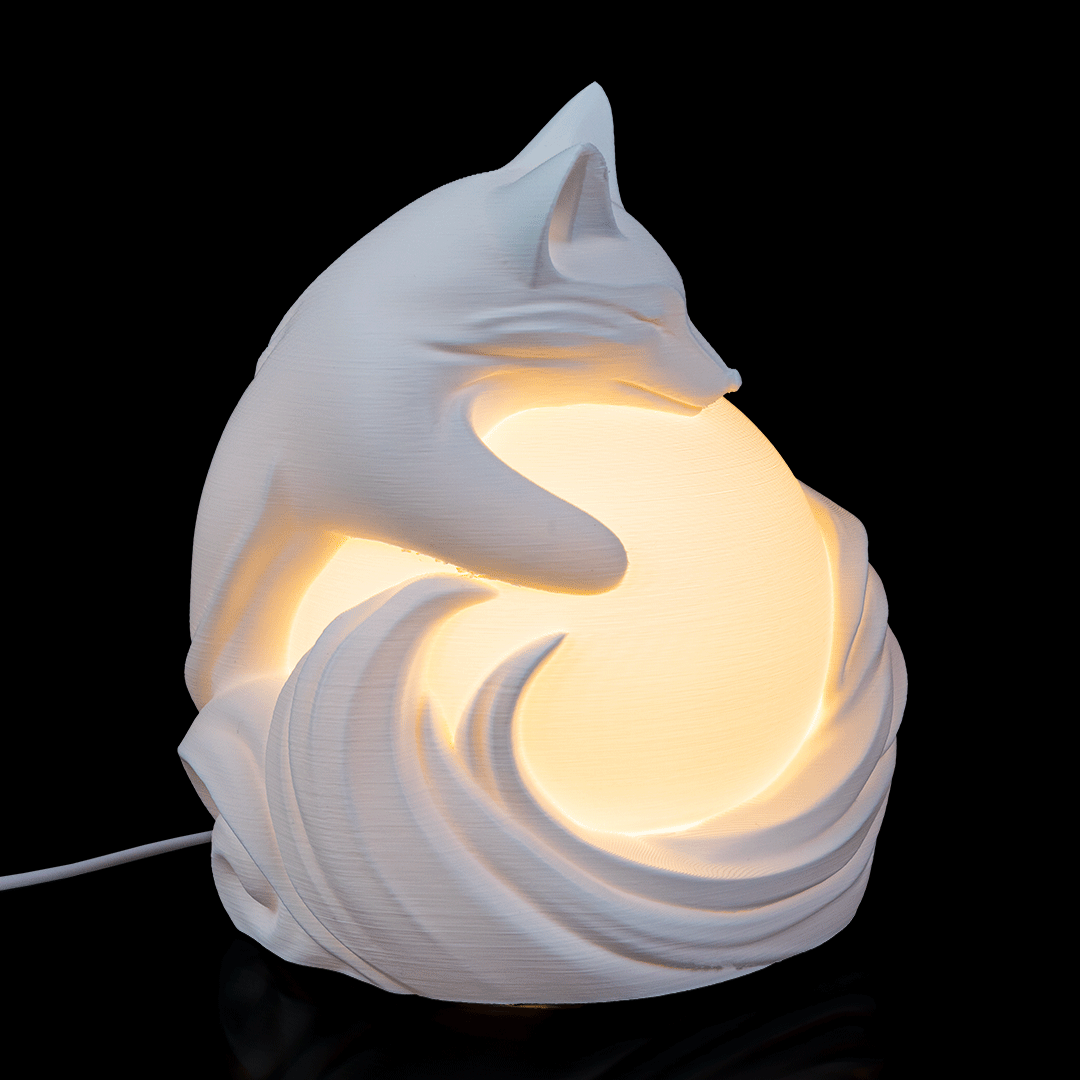 Side view of Vulpine Sphere Desk Lamp showing detailed fox figure surrounding spherical light