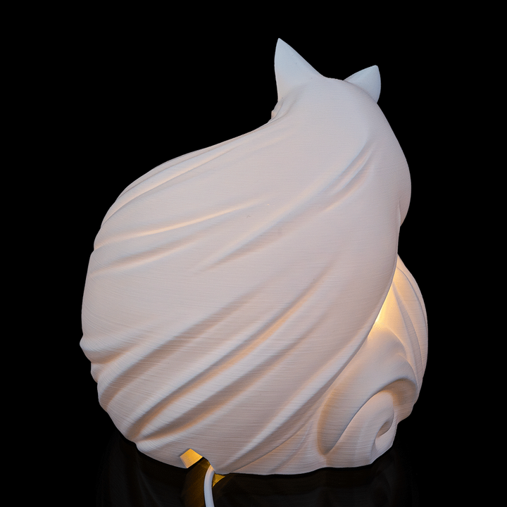 Vulpine Sphere Desk Lamp placed on nightstand creating warm ambient lighting in cozy room
