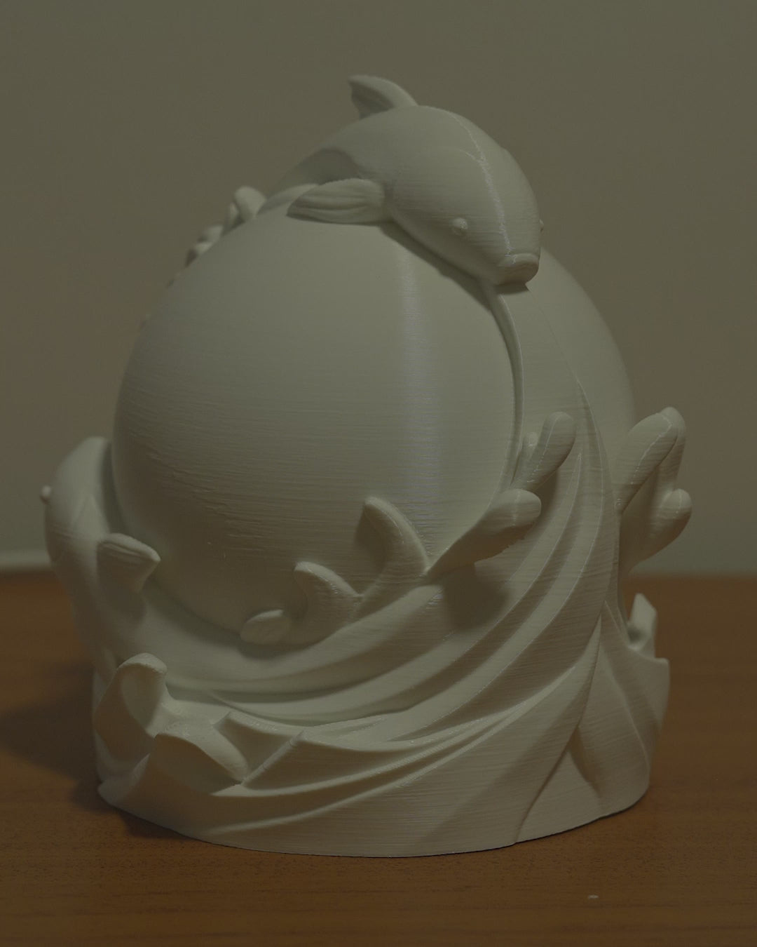 Video of Twin Fish Sphere Lamp unlit showing sculptural fish design surrounding the globe and turning on.