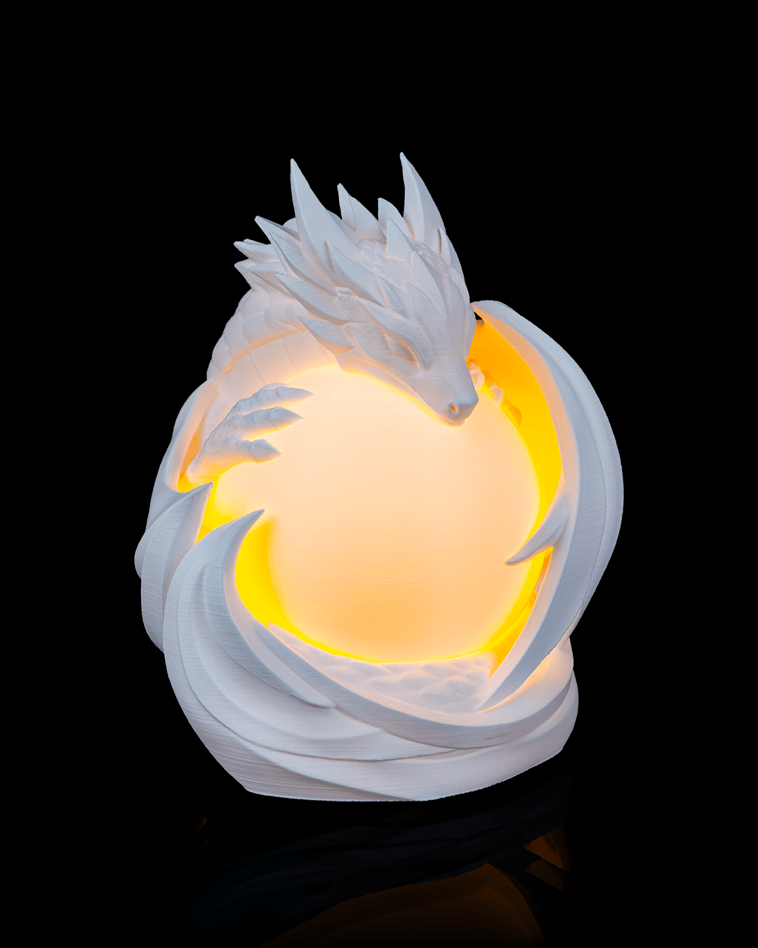 Video of Dragon Sphere Desk Lamp glowing and rotating to showcase detailed dragon design around illuminated globe